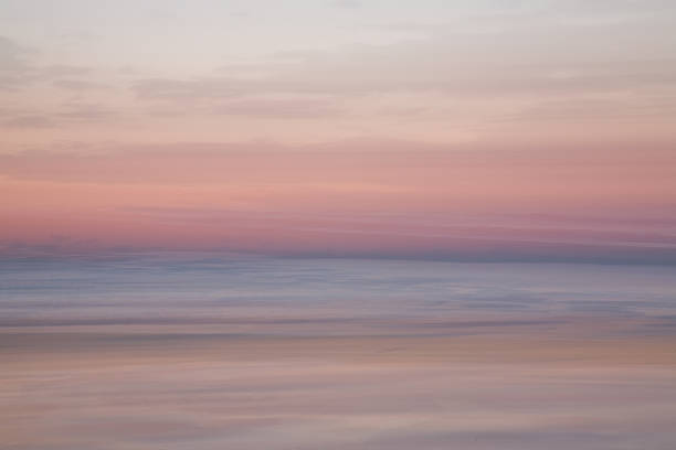 istock Lovely soft waves at sunrise on the beach 468940606