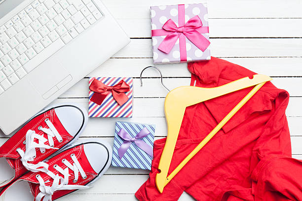 istock White computer and gumshoes with clothes 468941124