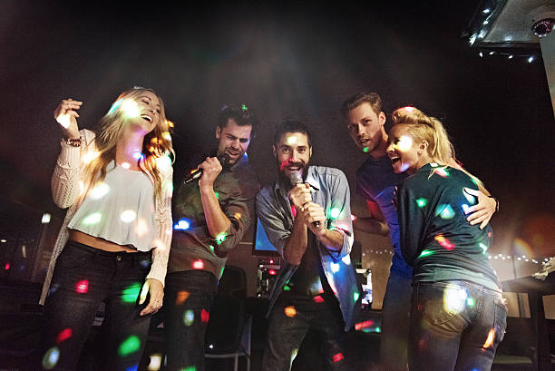istock Group of friends doing karaoke 468941326