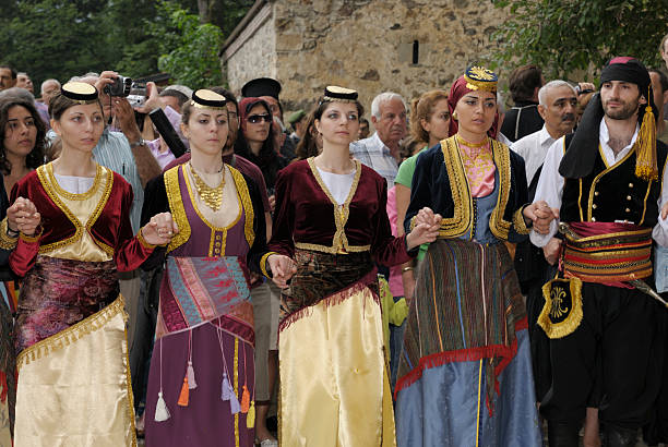 Greek dancers during the celebration of Dormition in Sumela monastery Sumela monastery, Trabzon, Turkey - August 15, 2008: Greek dancers during the celebration of Dormition of the Mother of God. The Greeks were expelled from Turkey in 1923 sumela monastery stock pictures, royalty-free photos & images