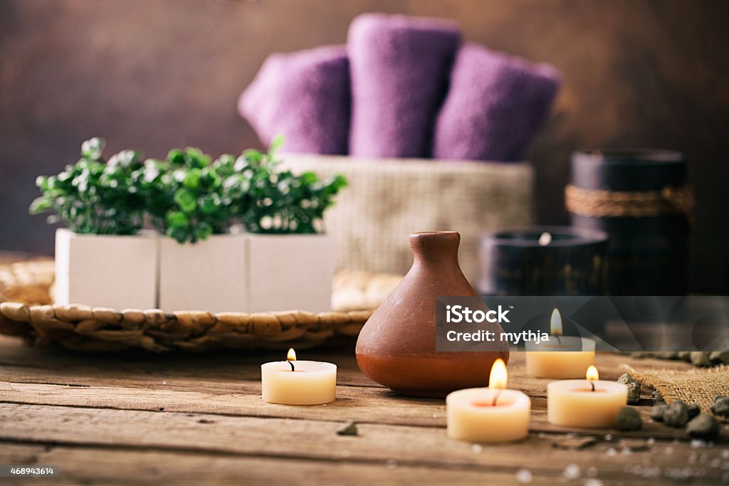 Spa setting Spa and wellness setting with flowers and towels. Dayspa nature products Domestic Room Stock Photo