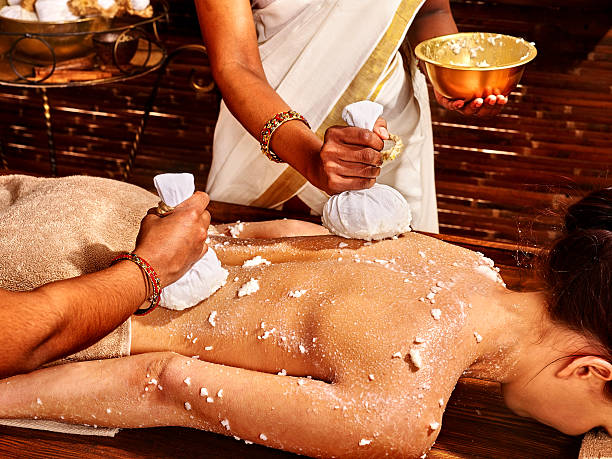 istock Woman having massage with pouch of rice 468944314