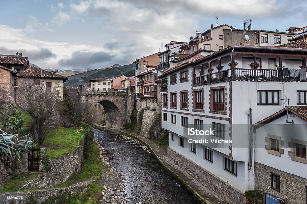 Friends View of the main bridge of Potes in Cantabria. This view is from a smaller bridge down the river made out of stone as well. Cantabria Stock Photo
