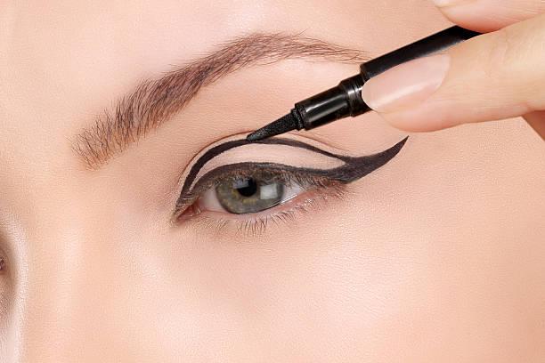 istock Beautiful model applying foundation with a brush 468947266