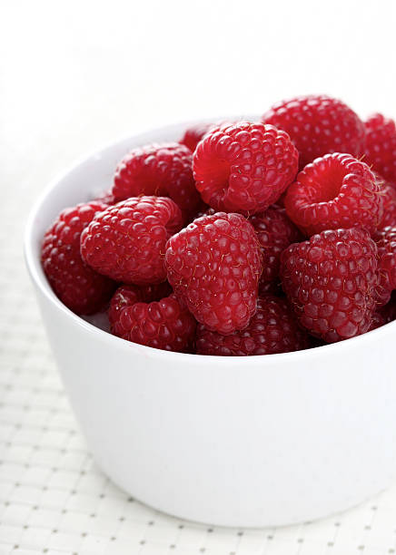 istock Raspberries in bowl - close-up 468948610