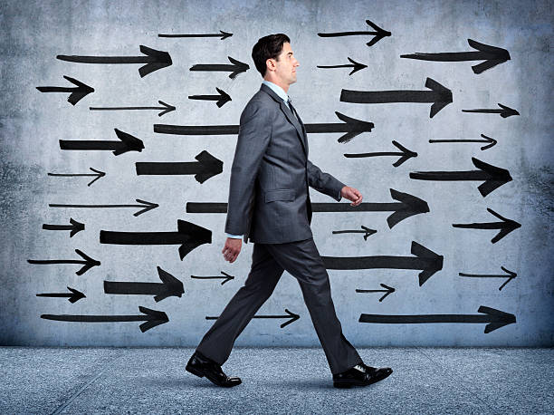 istock Arrows Pointing The Way For Businessman 468948838