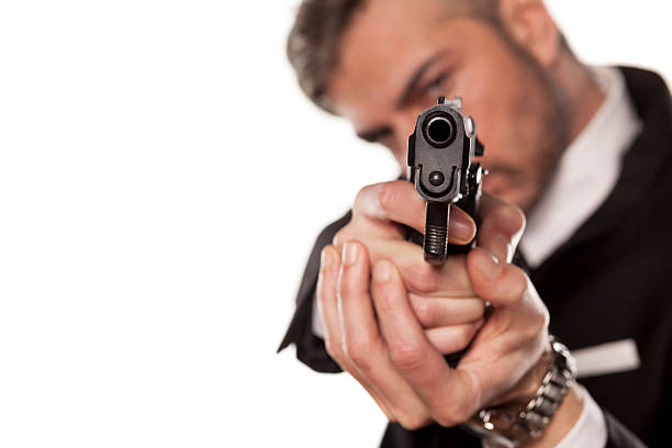 istock man in a suit and a gun 468949132