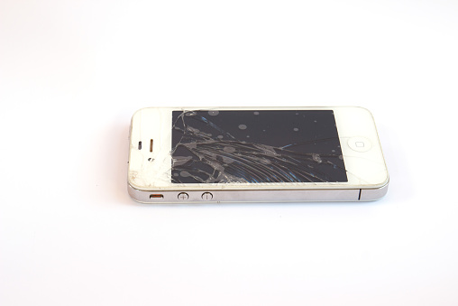 Chiangmai, Thailand - February 2, 2015: Shattered white Apple iphone (mobile phone) on white background
