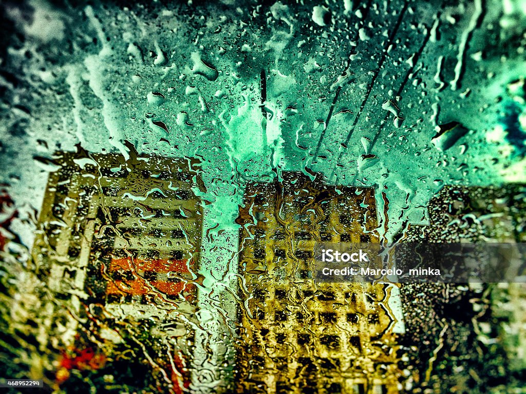 Raindrops on windshield and three skyscrapers on rain. Raindrops on windshield and three skyscrapers on rain. Taken by Iphone 6. Post processing with Lightroom, Photoshop and Nick Software. 2015 Stock Photo