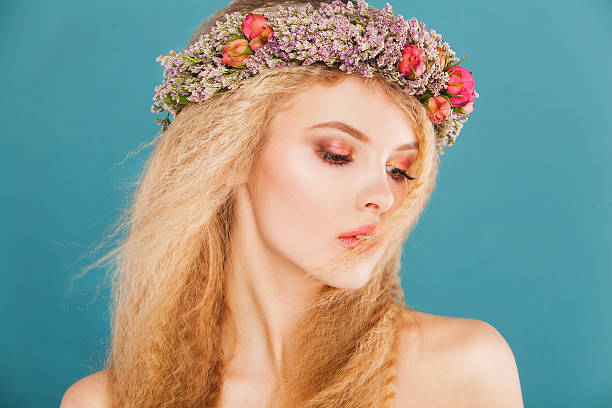 istock young model with wreath of bright flowers on her head 468955260