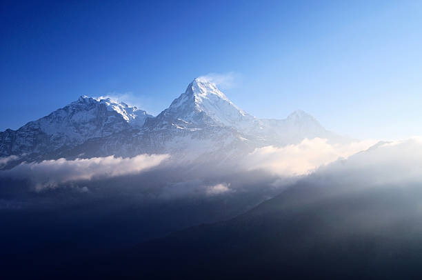 istock Sun Rays over Snow capped mountain Machapuchare, Annapurna Himalaya 468955930