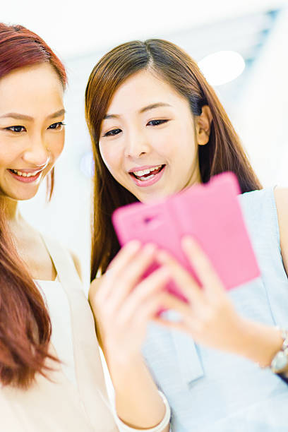 Women looking at smart phone screen