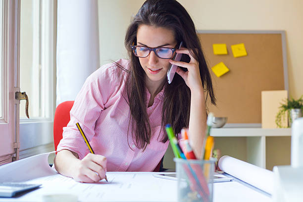 istock Beautiful young woman working in her office. 468960048