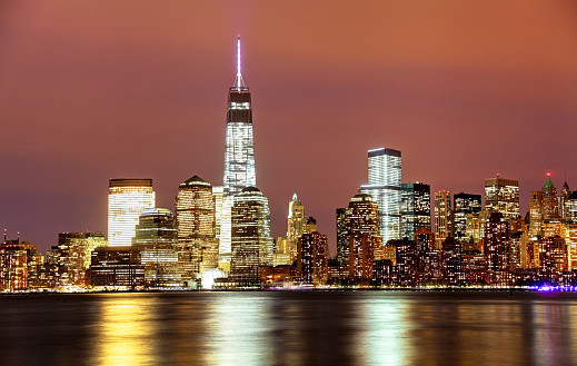 One World Trade Center and the New York City skyline from the Hudson River across from the lower tip of Manhattan