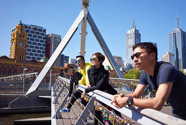 travelers on bridge stock photo