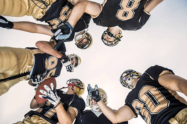 istock American football players making a strategy. 468960823