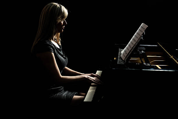istock Female artist playing the piano. 468960837