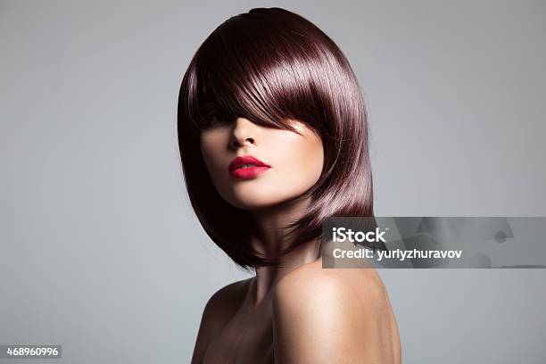 Beautiful Model With Perfect Glossy Brown Hair Stock Photo - Download Image Now - 2015, Adjusting, Adult