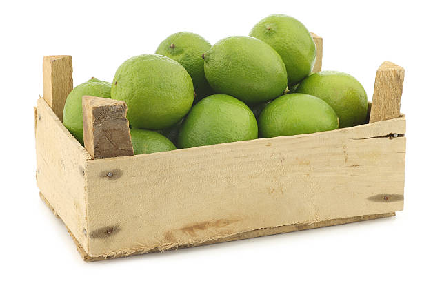 istock lime fruits in a wooden crate 468961210
