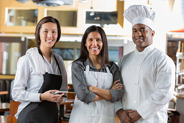 istock Diverse staff in modern open kitchen restaurant dining room 468961617