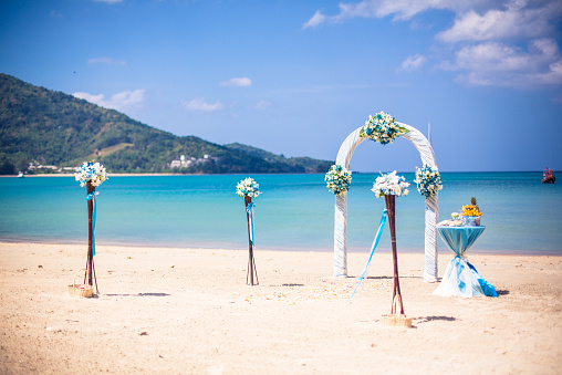 exotic ceremony wedding european style arch on  tropical beach 