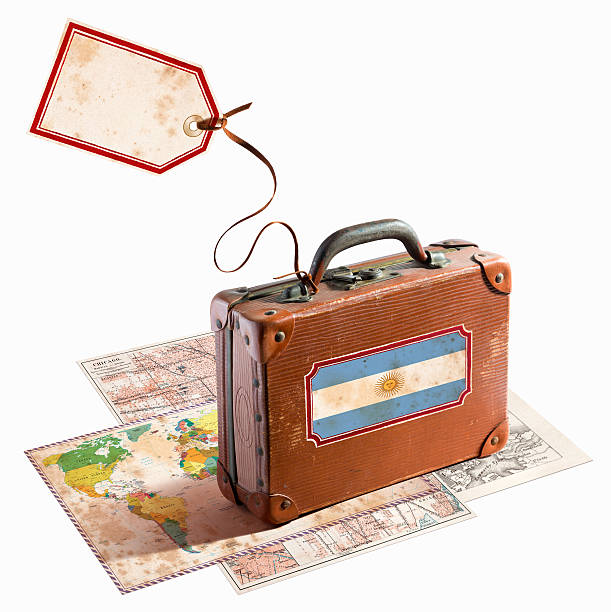 istock Antique leather suitcase on different maps Argentina flag 468963627