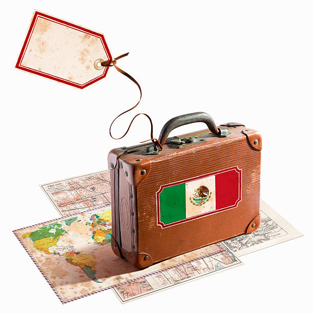 istock Antique leather suitcase on different maps Mexico flag 468964595