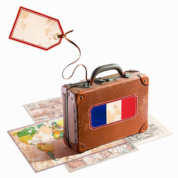 istock Antique leather suitcase on different maps France flag 468964605