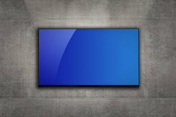 istock Blank LCD television mounted on a concrete wall 468964983