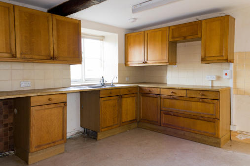 An empty kitchen in a vacant house