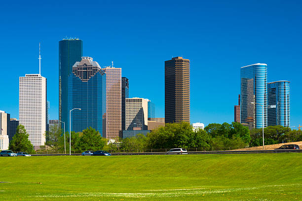 istock Houston downtown skyline closeup view with green lawn 468967088