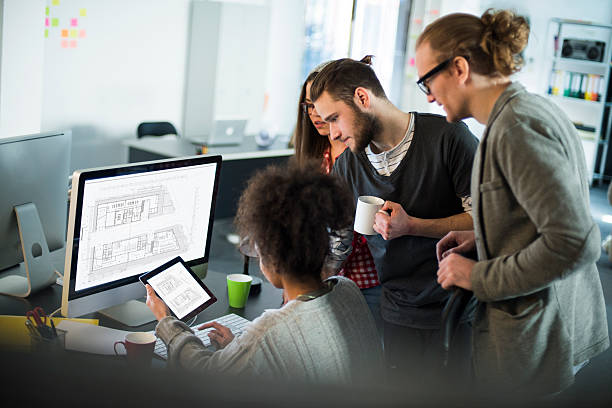 At work Group of young architects working in office african american architecture stock pictures, royalty-free photos & images