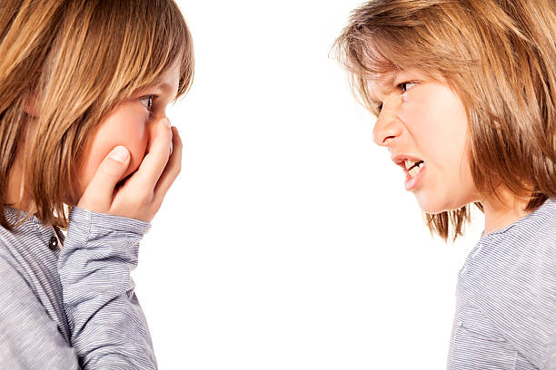 istock two twin brothers yelling 468967818