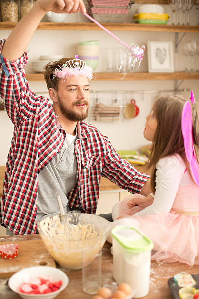 istock Father and daughter baking in kitchen. 468967984