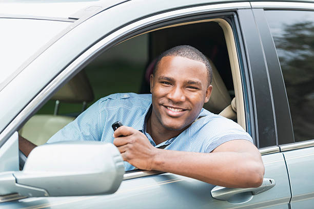 istock Young African American man driving car 468968050