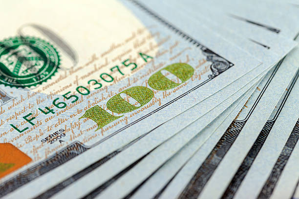 istock Heap of one hundred dollar bills close up 468971809