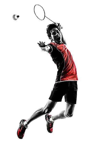 one asian badminton player young man in silhouette white background