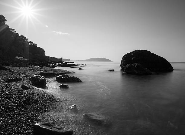istock Minimalist misty seascape with rocks at long exposure. 468972666