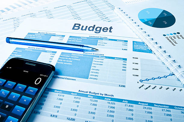 Budget Budget planing with calculator and pie charts. home finances photos stock pictures, royalty-free photos & images