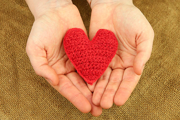 istock Knitting heart in the hands 468976511