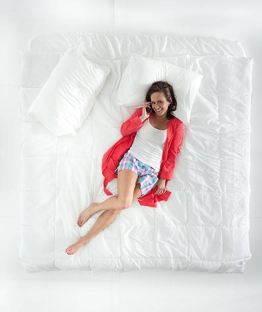 istock Above view of smiling woman on mobile 468976648