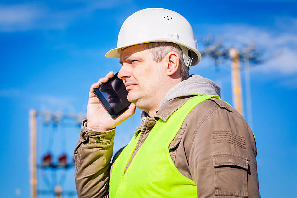 istock Electrical engineer talking on cell phone at outdoors 468976814