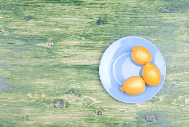 istock typical yellow lemon on a green chalkboard space for text 468977804