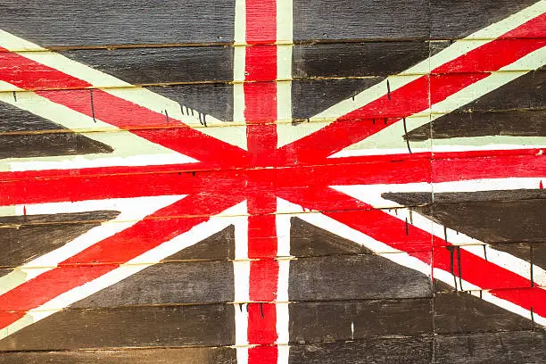 Great britain flag painted on old wood background in Amphawa floating market