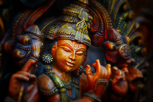 Wooden statue of Lord Krishna