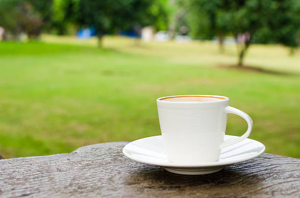 istock Cup of coffee on wooden table 468978175
