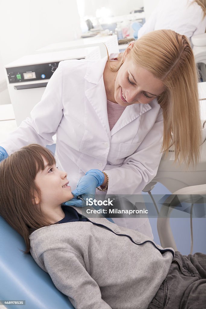 My dentist Preschool kid trusting the dentist and having no fear. Angled Mirror Stock Photo