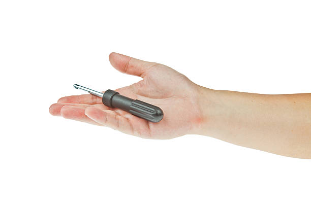 istock Screwdriver withh hand isolated on a white background 468978800