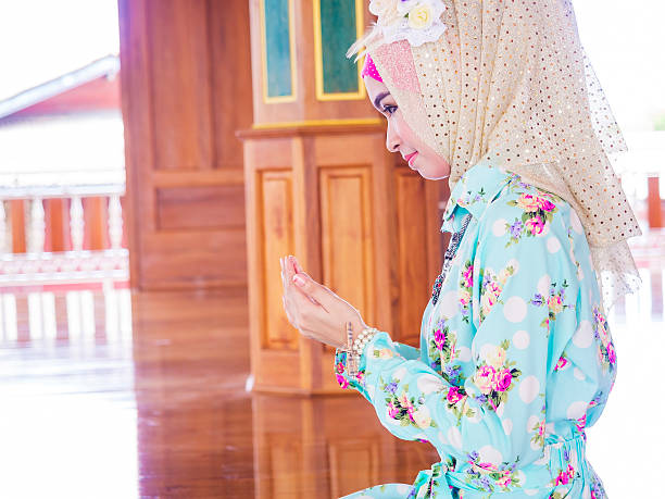 istock young muslim woman praying for Allah 468978864