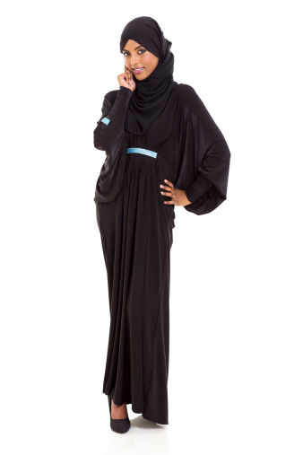 portrait of beautiful muslim woman standing on white background